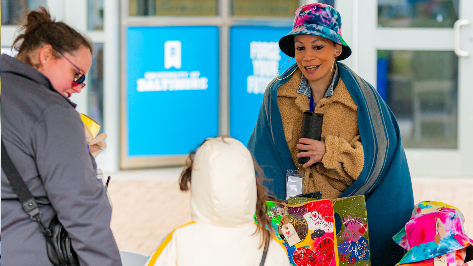 A vendor speaks to visitors.