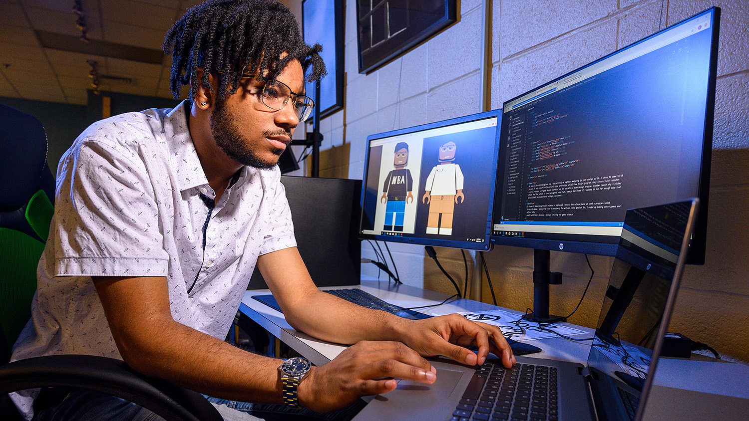 A student works on a computer in 2019.